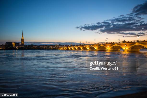 france, bordeaux, historic bridge pont de pierre over the garonne river at sunset - gironde photos et images de collection