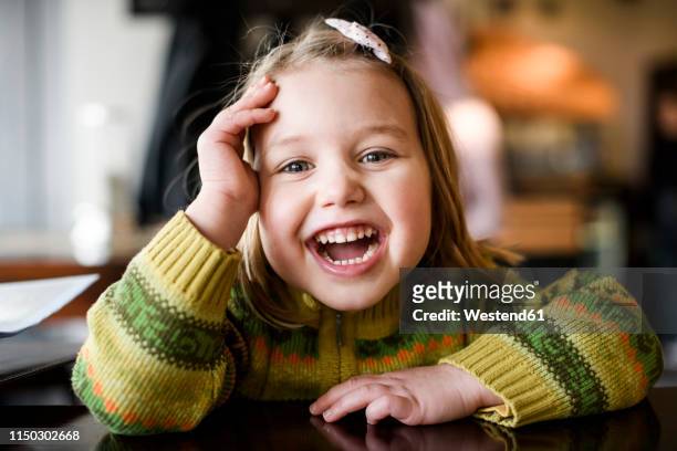 portrait of laughing girl - lachen stock-fotos und bilder