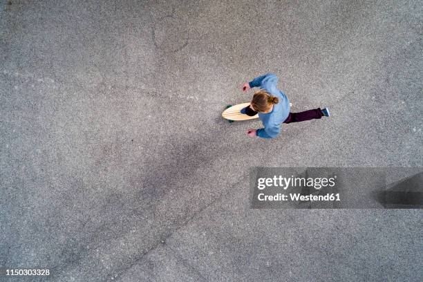 man longboarding, top view - person skateboarding stock pictures, royalty-free photos & images