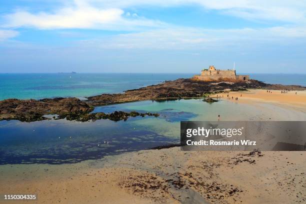 grand bé island, seen from saint-malo walls - st malo stock pictures, royalty-free photos & images