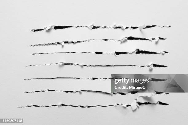 scratches on white paper - losbreken stockfoto's en -beelden