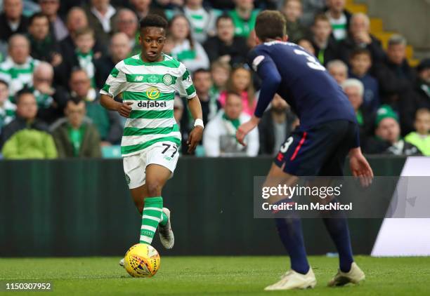 Karamoko Dembele of Celtic is faced by Conor Shaughnessy of Hearts during the Ladbrokes Scottish Premiership match between Celtic and Hearts at...