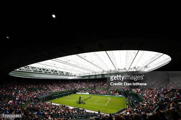 General view of No. 1 Court with the new roof closed as Kim Clijsters of Belgium serves to Venus Williams of the United States during the Wimbledon...