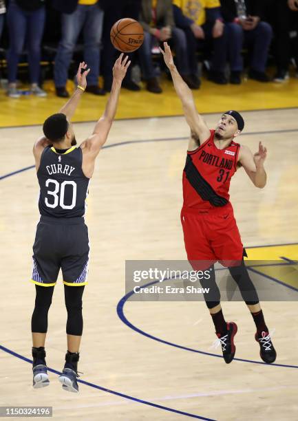 Seth Curry of the Portland Trail Blazers guards Stephen Curry of the Golden State Warriors during Game Two of the Western Conference Finals of the...