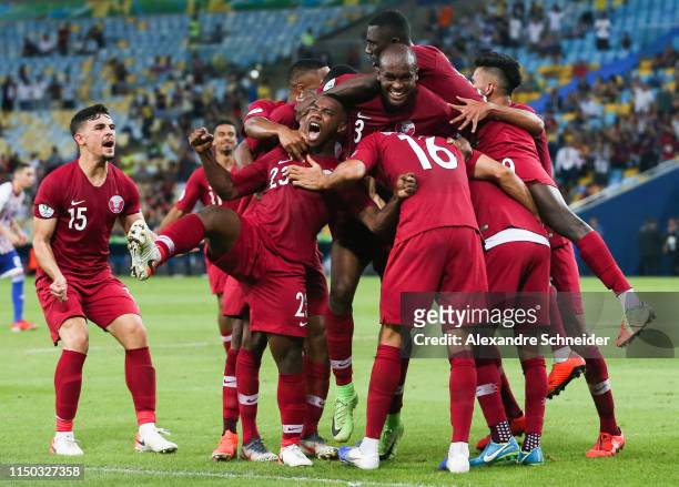 Boualem Khoukhi of Qatar celebrates with teammates after scoring the second goal of his team during the match against Paraguay for the Copa America...