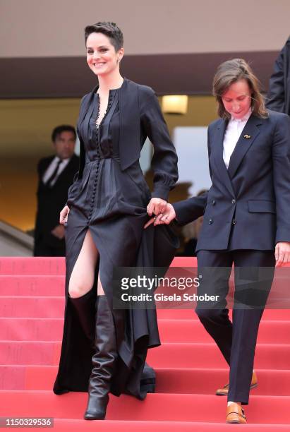 Noemie Merlant and Benedicte Couvreur depart the screening of "Portrait Of A Lady On Fire " during the 72nd annual Cannes Film Festival on May 19,...