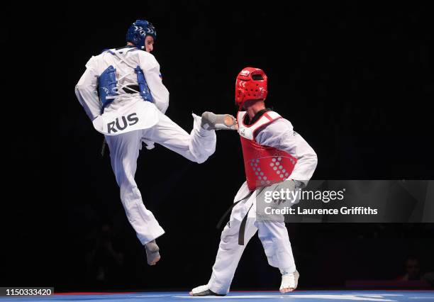 Vladislav Larin of Russia competes against Icaro Miguel Martin Soares of Brazil in the Final of the Mens -87kg during Day 5 of the World Taekwondo...