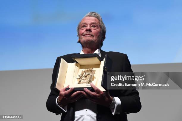Alain Delon accepts the Palme d'Or d'Honneur during the Ceremony for Palme Honneur during during the 72nd annual Cannes Film Festival on May 19, 2019...