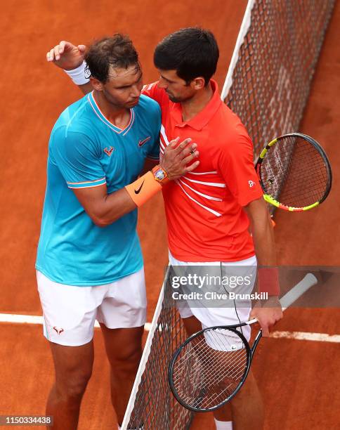 Rafael Nadal of Spain shakes hands at the net after his three set victory against Novak Djokovic of Serbia in the men's final during day eight of the...