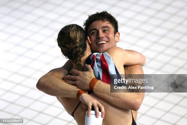Thomas Daley and Synchro partner Grace Reid of Great Britain celebrate winning Gold in the Mixed 3m Synchro Springboard during day three of the...
