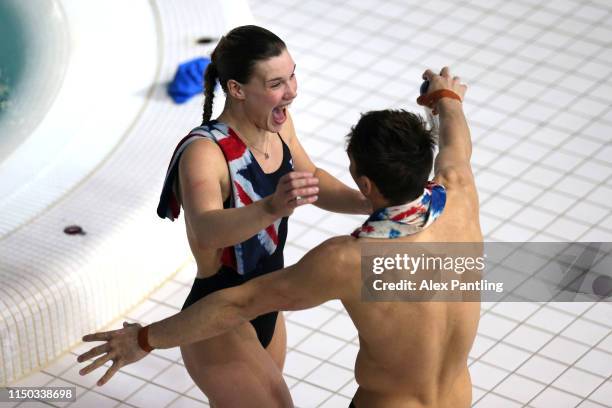 Thomas Daley and Synchro partner Grace Reid of Great Britain celebrate winning Gold in the Mixed 3m Synchro Springboard during day three of the...