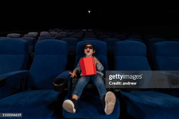 happy boy watching a 3d movie at the cinema - children theater stock pictures, royalty-free photos & images