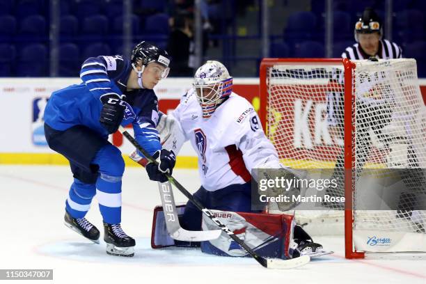 Florian Hardy, goaltender of France makes a save on Kaapo Kakko of Finland during the 2019 IIHF Ice Hockey World Championship Slovakia group A game...