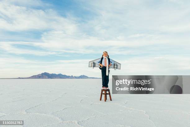 young girl businesswoman with jet pack - jet pack stock pictures, royalty-free photos & images