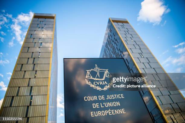 June 2019, Luxembourg, Luxemburg: The picture shows a sign in front of the office towers of the European Court of Justice with the inscription "Cour...