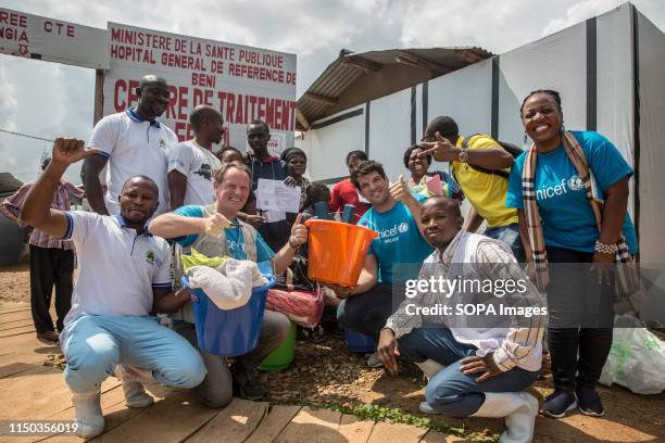 Retired Irish rugby player and UNICEF ambassador Donncha o'Callaghan poses for a picture outside an Ebola treatment centre with a team from Unicef...