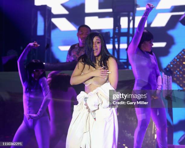 After a wardrobe malfunction, Cardi B performs in a Palms Casino robe on day four of Bonnaroo Music And Arts Festival on June 16, 2019 in Manchester,...