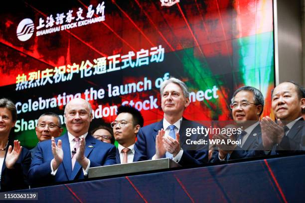 British Chancellor of the Exchequer Philip Hammond and Chinese Vice-Premier Hu Chunhua attend the opening of the markets at the London Stock Exchange...