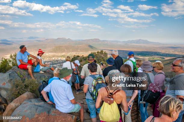Group of tourists at a view point at Camdeboo National Park, a wilderness area with unusual rock formations outside of Graaff-Reinet in South Africa.