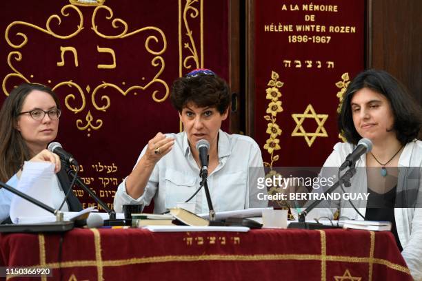 Romania's pupil rabbi Daniela Touati speaks next to French rabbi Floriane Chinsky and doctor in rabbinical literature Laliv Cleman during the Women...