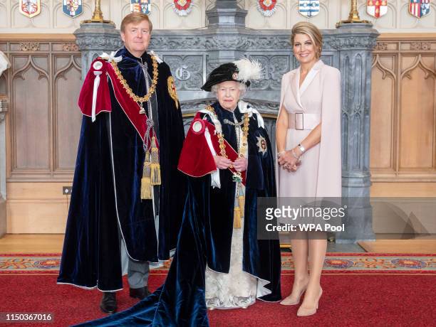 Queen Elizabeth II with King Willem-Alexander of the Netherlands and Queen Maxima of the Netherlands , after the king was invested as a Supernumerary...