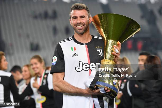 Andrea Barzagli of Juventus celebrates during the awards ceremony after winning the Serie A Championship during the Serie A match between Juventus...