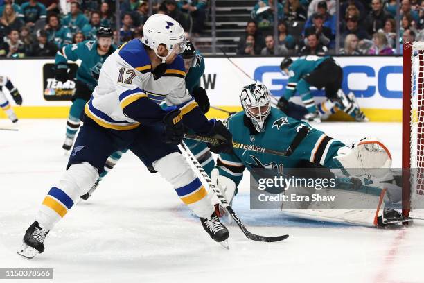 Martin Jones of the San Jose Sharks makes a save on a backhand shot by Jaden Schwartz of the St. Louis Blues in Game Five of the Western Conference...