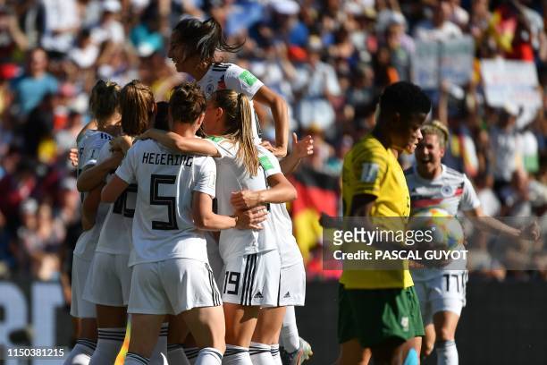 Germany's players celebrate their first goal during the France 2019 Women's World Cup Group B football match between South Africa and Germany, on...