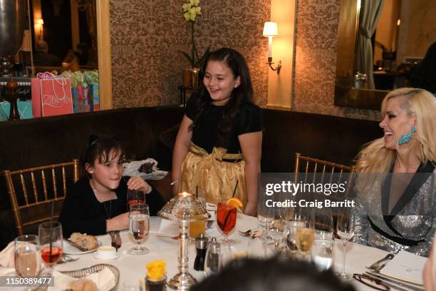 Michelle-Marie Heinemann and daughter Hyacinth Cornelia Heinemann and Skyler Helwig attend Hyacinth Cornelia Heinemann Communion Dinner at The...