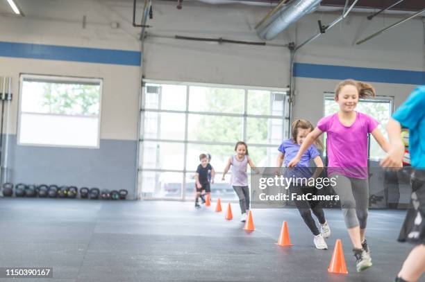 kids working out together in a health club - games workshop stock pictures, royalty-free photos & images