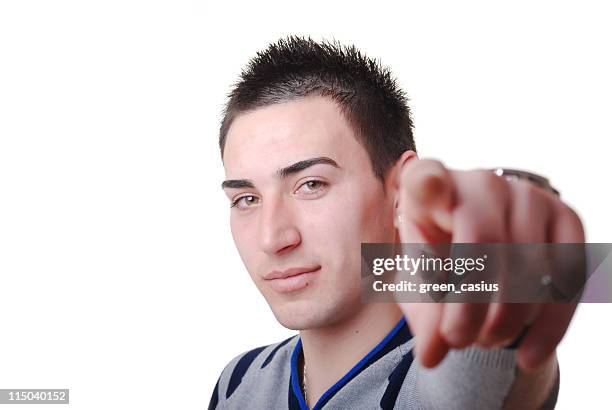 junge mit dem finger zeigen - heranlocken stock-fotos und bilder