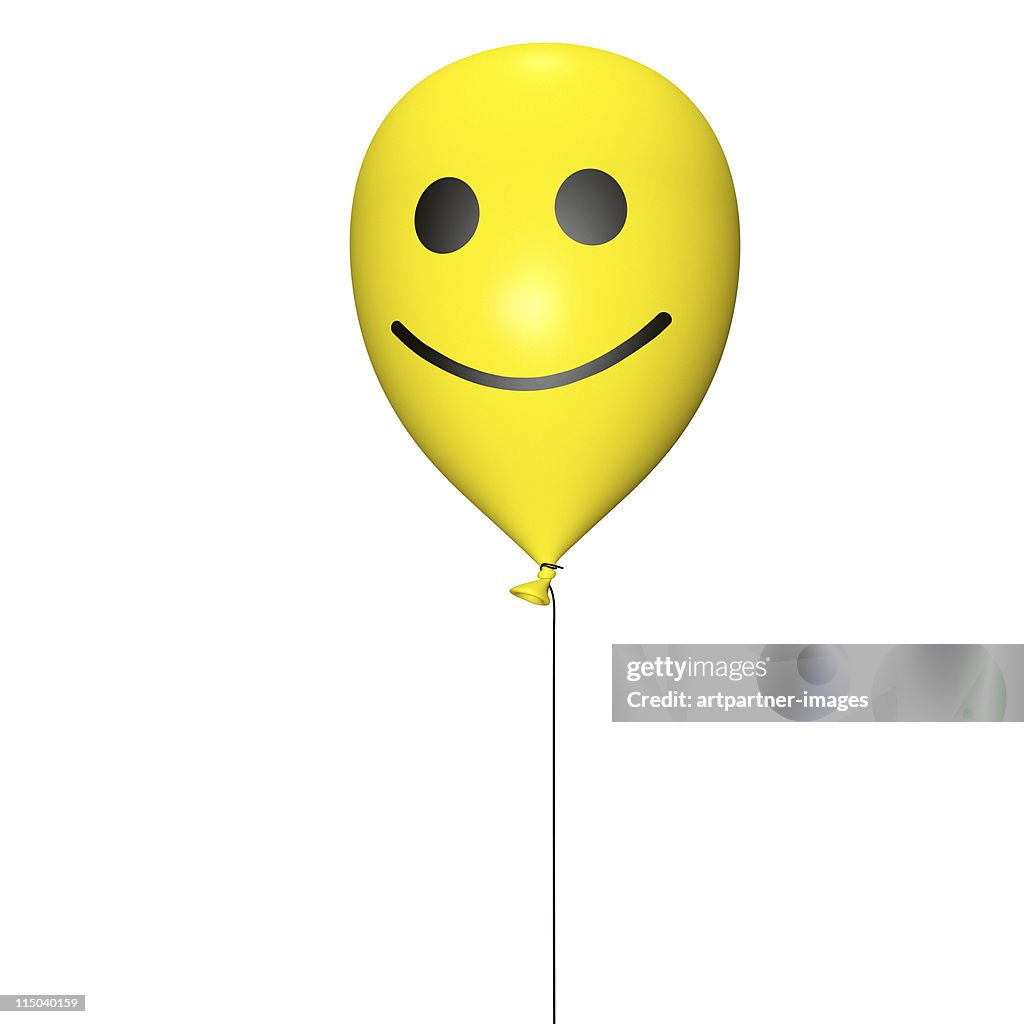 Yellow balloon with cord and smiley on white
