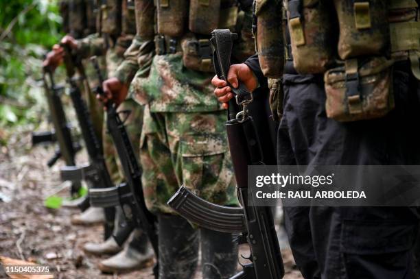 Members of the Ernesto Che Guevara front, belonging to the National Liberation Army guerrillas, line up at the jungle, in Choco department in...