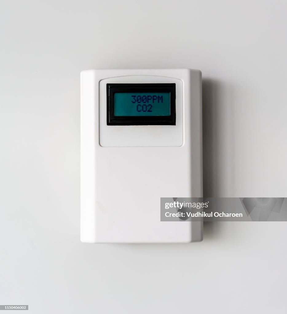 Carbon dioxide level. Digital CO2 meter equipment isolated on white background.