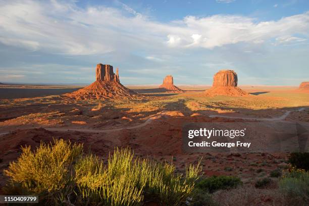 The sun sets on West and East Mitten Buttes and Merrick Butte in Monument Valley Navajo Tribal Park on June 12, 2019 in Monument Valley, Arizona....