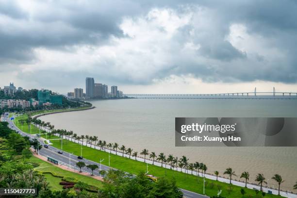 landscape of zhuhai city and hong kong-zhuhai-macao bridge - zhuhai foto e immagini stock