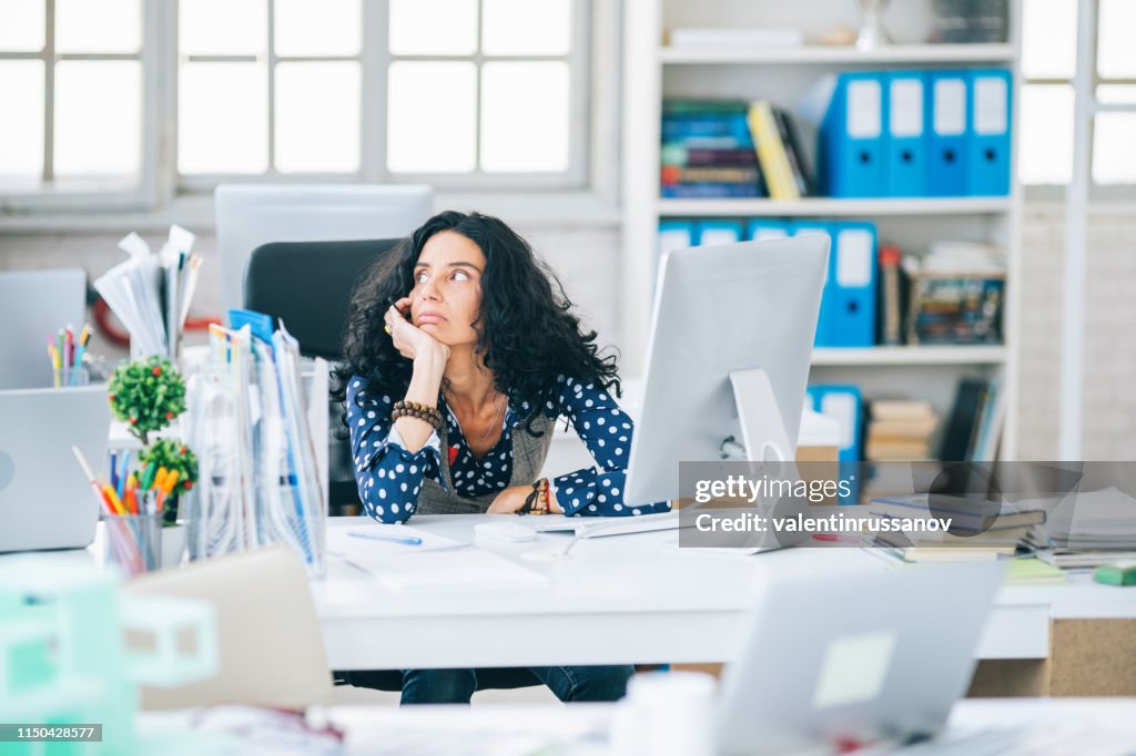 Mid adult interior designer having problem at office