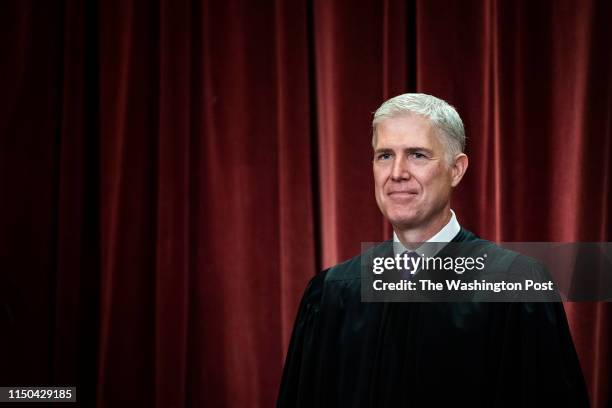 Associate Justice Neil Gorsuch poses with other Justices of the United States Supreme Court during their official group photo at the Supreme Court on...