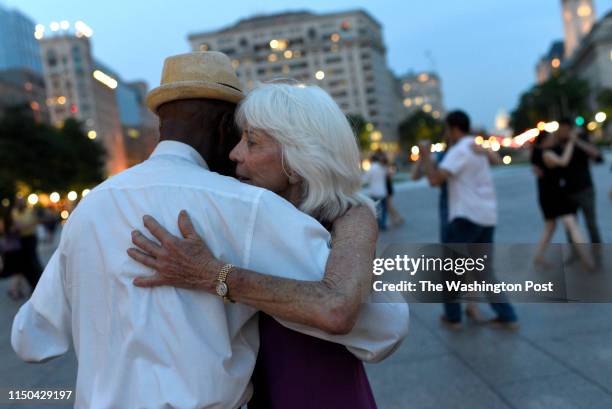 Ginette Kayser and Wesley Taylor dance with the Argentine tango group, Capital Tangueros, on June 16, 2019 at Freedom Plaza in Washington, DC. The...