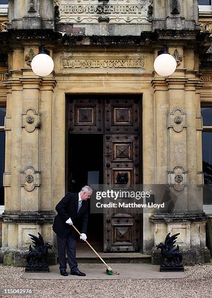 Colin the butler sweeps up outside Highclere Castle on March 15, 2011 in Newbury, England. Highclere Castle has been the ancestral home of the...