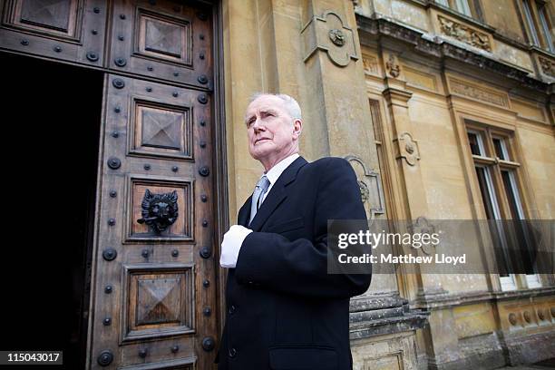 Colin the butler poses outside Highclere Castle on March 15, 2011 in Newbury, England. Highclere Castle has been the ancestral home of the Carnarvon...