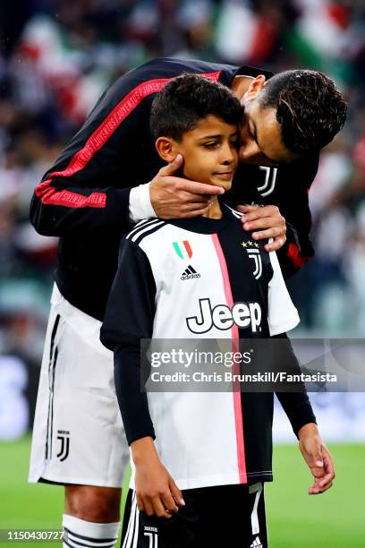 Cristiano Ronaldo of Juventus lines up with his son Cristiano Jr before the Serie A match between Juventus and Atalanta BC at Allianz Stadium on May...