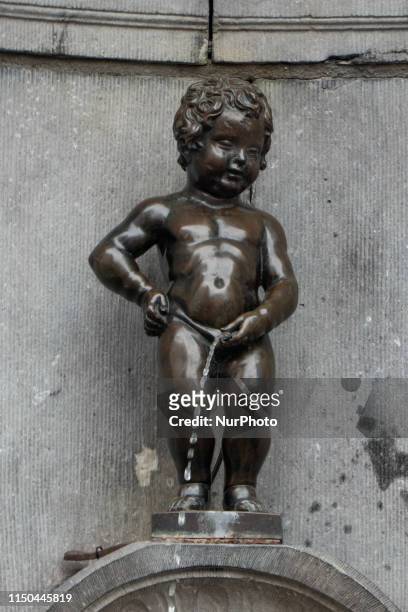 Manneken Pis or le Petit Julien, a landmark small bronze sculpture in Brussels. The famous statue, part of a larger water fountain of a pissing boy...