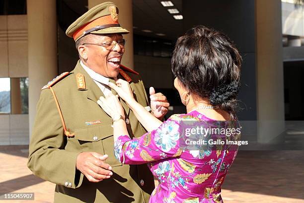 New head of the South African national army, Lieutenant General Solly Shoke has his tie corrected by Minister of Defence Lindiwe Sisulu at the...