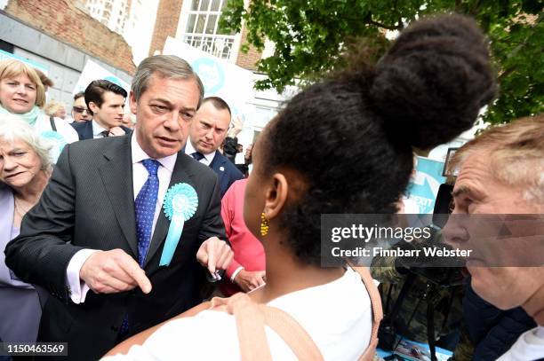 Protester confronts the Leader of the Brexit Party Nigel Farage and Ann Widdecombe during their tour of the town centre on May 20, 2019 in Exeter,...