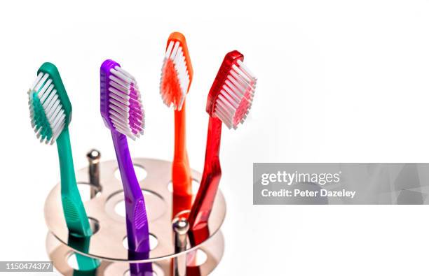 family group of toothbrushes - toothbrush photos et images de collection