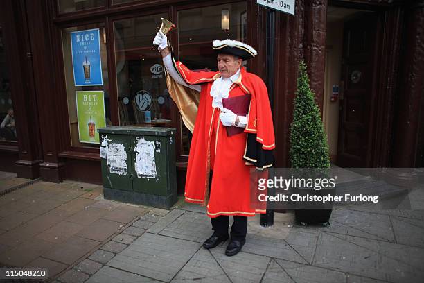 Whitehaven town crier Rob Romano announces a two minute silence for the victims of gunman Derrick Bird on June 2, 2011 in Whitehaven, England. On the...