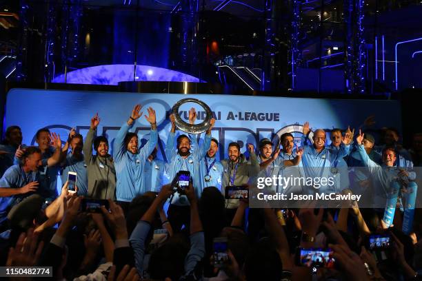 Alex Brosque of Sydney with teammates holds aloft the A-League Trophy during the Sydney FC A-League Grand Final celebrations at The Star on May 20,...