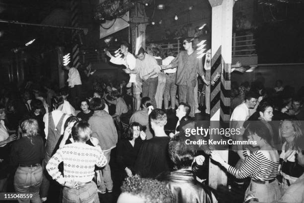 People dancing to acid house music at the Hacienda night club in Manchester, circa 1988.
