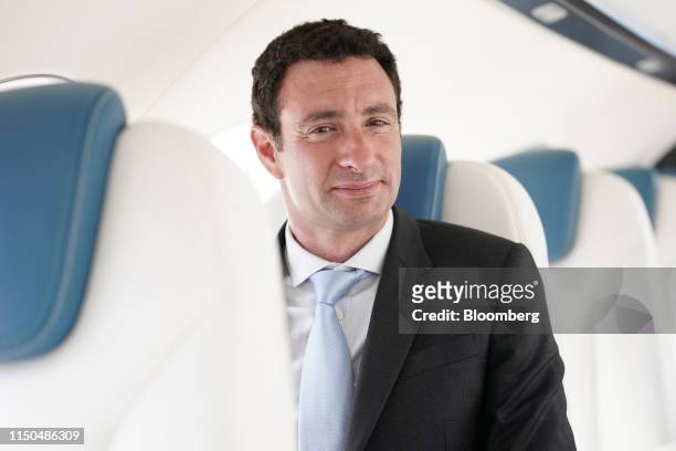Omer Bar-Yohay, chief executive officer of Eviation Aircraft Ltd., poses for a photograph inside the company's 'Alice' electric aircraft during the...